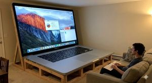 Generate an image of a 100-inch MacBook.

Author: ずは
Source: https://x.com/rsuOvO/status/1991696422178259157
