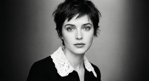 A cinematic, ultra-realistic monochrome portrait of a young woman with expressive eyes and a calm, intense gaze. Short, dark, neatly styl...