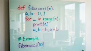 create a photo of python code to calculate the fibonacci numbers drawn on a glass whiteboard with coloring markers

Author: Patrick Loebe...