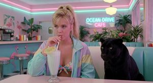 Cinematic photograph of a stylish young blonde woman in a bikini, with a black panther near her, in a pastel windbreaker in a small bikin...