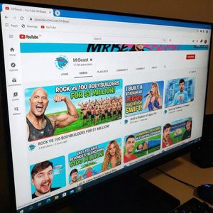 A YouTube channel page identical to the real MrBeast layout, same camera angle and perspective as the reference photo. Keep the YouTube i...