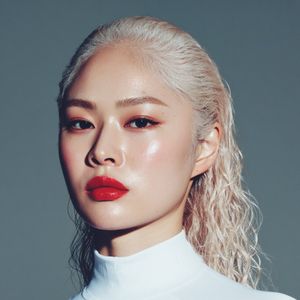 Enhance and upscale the image while keeping composition and colors identical. Eliminate blur and give the skin a lifelike, detailed look:...